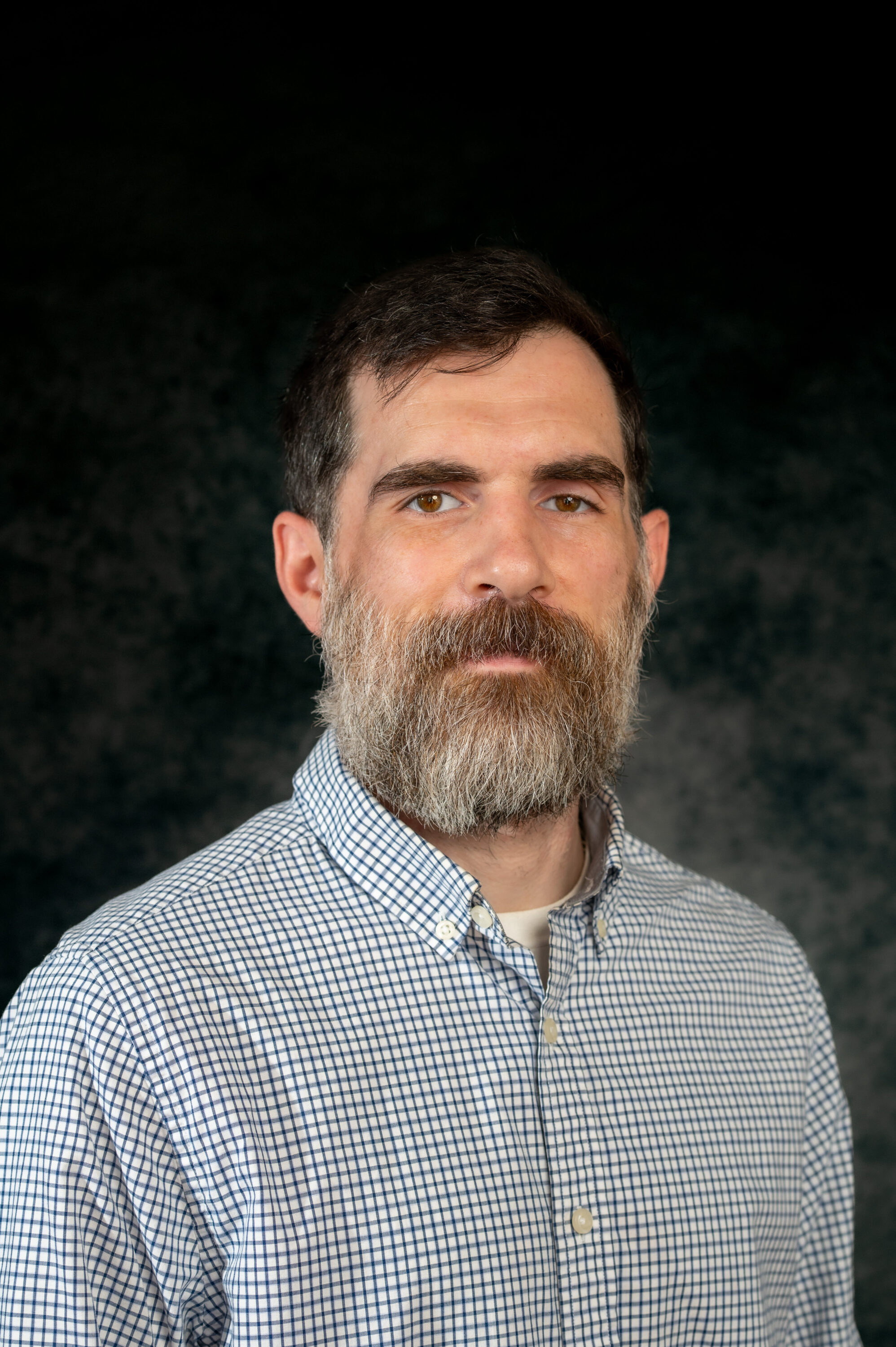 Bearded man in checkered shirt portrait
